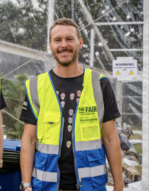 Rob, another director at The Fair, smiling in his hi-vis vest
